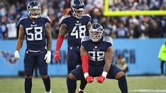 Tennessee Titans defensive end Jeffery Simmons (98) reacts after a play in front of outside linebacker Bud Dupree (48) and outside linebacker Harold Landry (58).