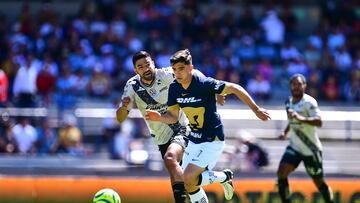 Diego de Buen (L) of Puebla fights for the ball with Rodrigo Lopez (R) of Pumas during the 6th round match between Pumas UNAM and Puebla as part of the Torneo Clausura 2024 Liga BBVA MX at Olimpico Universitario Stadium on February 11, 2024 in Mexico City, Mexico.