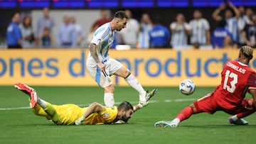 Argentina's forward #10 Lionel Messi shoots but fails to score as he fights for the ball with Canada's goalkeeper #16 Maxime Crepeau (L) and Canada's defender #13 Derek Cornelius during the Conmebol 2024 Copa America tournament group A football match between Argentina and Canada at Mercedes Benz Stadium in Atlanta, Georgia, on June 20, 2024. (Photo by CHARLY TRIBALLEAU / AFP)
