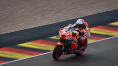 Honda Spanish rider Marc Marquez steers his motorbike during the qualifying session for the MotoGP German motorcycle Grand Prix at the Sachsenring racing circuit in Hohenstein-Ernstthal near Chemnitz, eastern Germany, on June 17, 2023. (Photo by Ronny Hartmann / AFP)