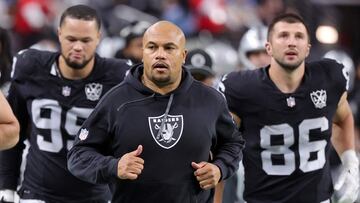 LAS VEGAS, NEVADA - JANUARY 05: Andre Carter II #99, head coach Antonio Pierce and John Samuel Shenker #86 of the Las Vegas Raiders leave the field at halftime of a game against the Los Angeles Chargers at Allegiant Stadium on January 05, 2025 in Las Vegas, Nevada. The Chargers defeated the Raiders 34-20. Ethan Miller/Getty Images/AFP (Photo by Ethan Miller / GETTY IMAGES NORTH AMERICA / Getty Images via AFP)