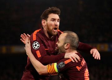 Lionel Messi celebrates with Andres Iniesta after scoring their first goal.