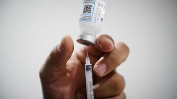 (FILES) In this file photo taken on January 12, 2022 a nurse prepares a dose of a Pfizer/BioNTech vaccine against the coronavirus disease Covid-19 in a social center of La Gavotte Peyret popular neighbourhood, in Septeme-Les-Vallons, near Marseille. - French Prime Minister announced on March 12, 2022 the opening of the fourth dose of vaccine "to the over 80s who have received their booster dose for more than three months", in the face of the slight rebound in the Covid epidemic, in an interview with Le Parisien. (Photo by CLEMENT MAHOUDEAU / AFP)