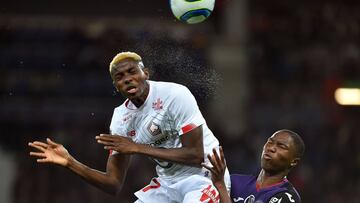 Lille's Nigerian midfielder Victor Osimhen (L) fights for the ball during the French L1 football match between Toulouse and Lille, at the Municipal Stadium in Toulouse, southern France, on October 19, 2019. (Photo by REMY GABALDA / AFP)