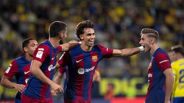 Barcelona's Portuguese forward #14 Joao Felix celebrates after scoring with teammates  during the Spanish league football match between Cadiz CF and FC Barcelona at the Nuevo Mirandilla stadium in Cadiz on April 13, 2024. (Photo by JORGE GUERRERO / AFP)