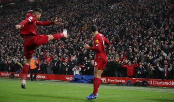 Soccer Football - Premier League - Liverpool v Manchester United - Anfield, Liverpool, Britain - January 19, 2020 Liverpool's Virgil van Dijk celebrates scoring their first goal with Roberto Firmino