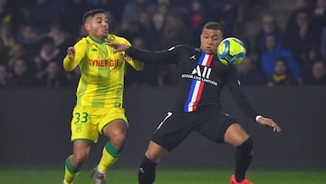 Paris Saint-Germain&#039;s French forward Kylian Mbappe (R) vies with Nantes&#039; Peruvian defender Percy Prado during the French L1 football match between Nantes (FCNA) and Paris Saint-Germain (PSG) on February 4, 2020 at La Baujeoire stadium in Nantes,