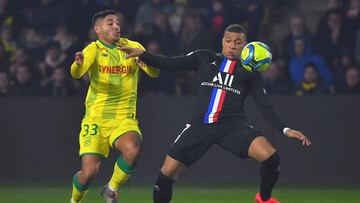 Paris Saint-Germain&#039;s French forward Kylian Mbappe (R) vies with Nantes&#039; Peruvian defender Percy Prado during the French L1 football match between Nantes (FCNA) and Paris Saint-Germain (PSG) on February 4, 2020 at La Baujeoire stadium in Nantes,