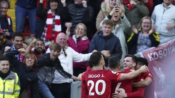 Liverpool's Andrew Robertson, 2nd right, celebrates with teammates after scoring his sides first goal during the English Premier League soccer match between Liverpool and Everton at Anfield stadium in Liverpool, England, Sunday, April 24, 2022. (AP P