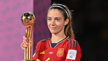 Spain's midfielder #06 Aitana Bonmati holds the trophy for the FIFA Golden Ball Award on the podium after the Australia and New Zealand 2023 Women's World Cup final football match between Spain and England at Stadium Australia in Sydney on August 20, 2023. (Photo by Izhar KHAN / AFP)