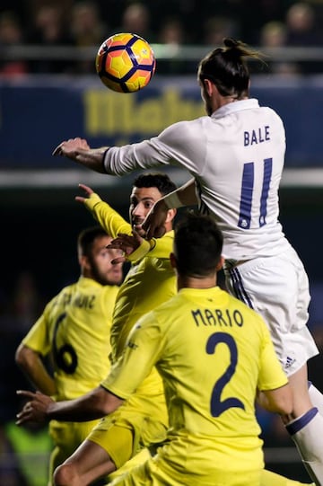 Real Madrid's Welsh forward, Gareth Bale, heads the ball to score a record-equalling feat.