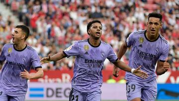 Real Madrid's Brazilian forward Rodrygo (C) celebrates after scoring a goal during the Spanish league football match between Sevilla FC and Real Madrid CF at the Ramon Sanchez Pizjuan stadium in Seville on May 27, 2023. (Photo by CRISTINA QUICLER / AFP)