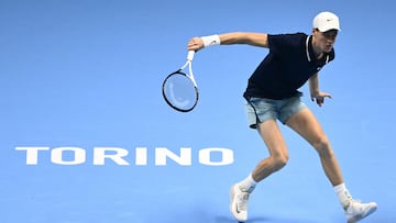 Italy's Jannik Sinner returns to Australia's Alex de Minaur during their match at the ATP Finals tennis tournament in Turin on November 10, 2024. (Photo by Marco BERTORELLO / AFP)