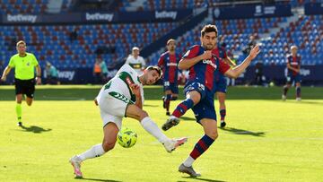 VALENCIA, SPAIN - NOVEMBER 21: Lucas Boye of Elche CF is challenged by Sergio Postigo of Levante UD during the La Liga Santander match between Levante UD and Elche CF at Ciutat de Valencia Stadium on November 21, 2020 in Valencia, Spain. Football Stadiums