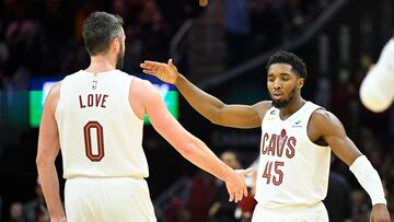 Oct 30, 2022; Cleveland, Ohio, USA; Cleveland Cavaliers forward Kevin Love (0) and guard Donovan Mitchell (45) celebrate in the fourth quarter against the New York Knicks at Rocket Mortgage FieldHouse. Mandatory Credit: David Richard-USA TODAY Sports