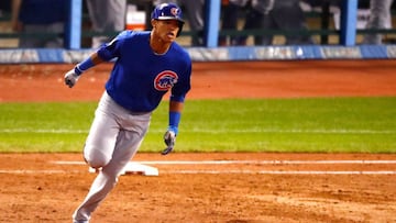 CLEVELAND, OH - NOVEMBER 01: Addison Russell #27 of the Chicago Cubs celebrates as he runs the bases after hitting a grand slam home run during the third inning against the Cleveland Indians in Game Six of the 2016 World Series at Progressive Field on November 1, 2016 in Cleveland, Ohio. Gregory Shamus/Getty Images/AFP
== FOR NEWSPAPERS, INTERNET, TELCOS & TELEVISION USE ONLY ==