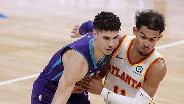 CHARLOTTE, NORTH CAROLINA - JANUARY 09: LaMelo Ball #2 of the Charlotte Hornets dribbles against Trae Young #11 of the Atlanta Hawks during the third quarter of their game at Spectrum Center on January 09, 2021 in Charlotte, North Carolina. NOTE TO USER: User expressly acknowledges and agrees that, by downloading and or using this photograph, User is consenting to the terms and conditions of the Getty Images License Agreement. Jared C. Tilton/Getty Images/AFP
== FOR NEWSPAPERS, INTERNET, TELCOS & TELEVISION USE ONLY ==