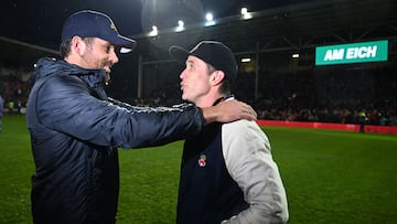 celebrate on the pitch after the English National League football match between Wrexham and Boreham Wood at the Racecourse Ground Stadium in Wrexham, north Wales, on April 22, 2023.