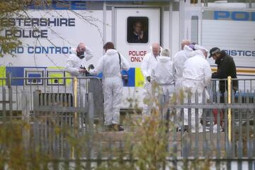 November 01, 2018 | Police investigators in forensics suits work at the helicopter crash site outside Leicester City Football Club's King Power Stadium.