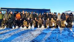 Ukrainian troops gather for a photo after being released in prisoner swap with Russia, amid Russia's attack on Ukraine, in an unknown location, Ukraine in this handout image released January 8, 2023. Andriy Yermak Via Telegram/Handout via REUTERS   THIS IMAGE HAS BEEN SUPPLIED BY A THIRD PARTY.