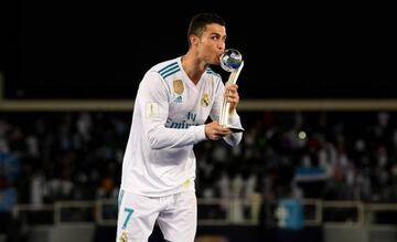 ABU DHABI, UNITED ARAB EMIRATES - DECEMBER 16: Cristiano Ronaldo of Real Madrid celebrates with the trophy after the FIFA Club World Cup UAE 2017 Final between Gremio and Real Madrid at the Zayed Sports City Stadium on December 16, 2017 in Abu Dhabi, Unit