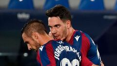 Levante&#039;s Spanish defender Jorge Miramon (L) speaks with Levante&#039;s Montenegrin midfielder Nikola Vukcevic during the Spanish league football match between Levante UD and Real Sociedad at the Ciutat de Valencia stadium in Valencia on December 19,