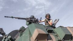 A Ukranian soldier sits a top of an armoured vehicle as it drives to frontline on the outskirts of Bakhmut, eastern Ukraine, on July 30, 2022. (Photo by BULENT KILIC / AFP) (Photo by BULENT KILIC/AFP via Getty Images)