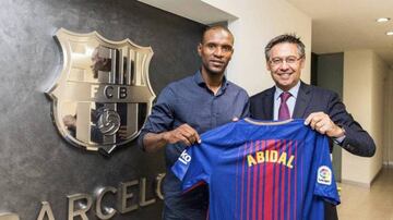 Eric Abidal and Josep Bartomeu.