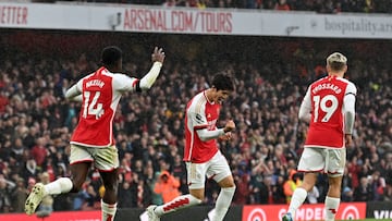 Arsenal's Japanese defender #18 Takehiro Tomiyasu (C) celebrates after scoring their fifth goal during the English Premier League football match between Arsenal and Sheffield United at the Emirates Stadium in London on October 28, 2023. (Photo by Glyn KIRK / AFP) / RESTRICTED TO EDITORIAL USE. No use with unauthorized audio, video, data, fixture lists, club/league logos or 'live' services. Online in-match use limited to 120 images. An additional 40 images may be used in extra time. No video emulation. Social media in-match use limited to 120 images. An additional 40 images may be used in extra time. No use in betting publications, games or single club/league/player publications. /