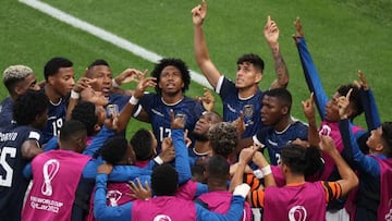 Ecuador players celebrates after Ecuador's forward #13 Enner Valencia (C) scored his team's first goal during the Qatar 2022 World Cup Group A football match between the Netherlands and Ecuador at the Khalifa International Stadium in Doha on November 25, 2022. (Photo by ADRIAN DENNIS / AFP) (Photo by ADRIAN DENNIS/AFP via Getty Images)