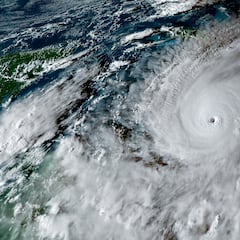 Risk-taking pilot takes stunning photos from inside ‘hurricane of the century’