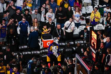 Apr 9, 2025; Dallas, Texas, USA; Los Angeles Lakers guard Luka Doncic (77) covers his face as the Dallas Mavericks play a tribute video for Doncic before the game against the Lakers at the American Airlines Center. Mandatory Credit: Jerome Miron-Imagn Images