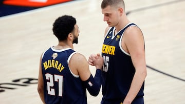 Jun 4, 2023; Denver, CO, USA; Denver Nuggets center Nikola Jokic (15) and guard Jamal Murray (27) react in the second quarter against the Miami Heat in game two of the 2023 NBA Finals at Ball Arena. Mandatory Credit: Isaiah J. Downing-USA TODAY Sports