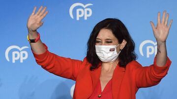 Madrid regional president and People&#039;s Party (PP) candidate Isabel Diaz Ayuso waves to supporters at the People&#039;s Party (PP) headquarters in Madrid after the Madrid regional elections on May 4, 2021. - Spain&#039;s right-wing People&#039;s Party