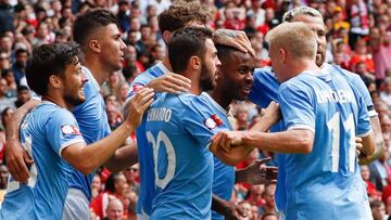 Manchester City&#039;s English midfielder Raheem Sterling (3R) celebrates scoring the opening goal during the English FA Community Shield football match between Manchester City and Liverpool at Wembley Stadium in north London on August 4, 2019. (Photo by 