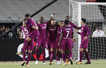 City celebrate their opening goal against Madrid.