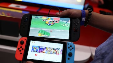 An attendee compares the Nintendo Switch 2 (top) to the original version during the Nintendo Switch 2 Experience at the ExCeL London international exhibition and convention centre in London, Britain, April 11, 2025. REUTERS/Isabel Infantes