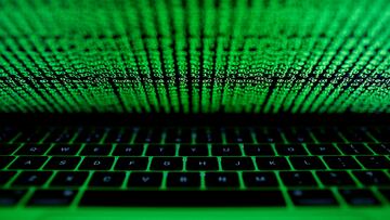 FILE PHOTO: A computer keyboard lit by a displayed cyber code is seen in this illustration picture taken on March 1, 2017. REUTERS/Kacper Pempel/Illustration/File Photo