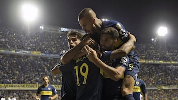 Argentina&#039;s Boca Juniors defender Lisandro Lopez (R), forward Mauro Zarate (C) and forward Dario Benedetto celebrate after Colombia&#039;s Deportes Tolima forward Marco Perez scored an own goal during a Copa Libertadores 2019 group G football match at the &quot;Bombonera&quot; stadium in Buenos Aires, on March 12, 2019. (Photo by JUAN MABROMATA / AFP)