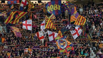 Barcelona's supporters wave flags during the UEFA Champions League 1st round day 1 Group H football match between FC Barcelona and Royal Antwerp FC at the Estadi Olimpic Lluis Companys in Barcelona on September 19, 2023. (Photo by LLUIS GENE / AFP)