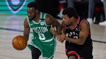 Toronto Raptors guard Kyle Lowry (7) tries to hold on to Boston Celtics guard Kemba Walker (8) during the second half of an NBA conference semifinal playoff basketball game Wednesday, Sept. 9, 2020, in Lake Buena Vista, Fla. (AP Photo/Mark J. Terrill)