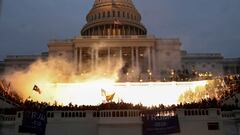 FILE PHOTO: An explosion caused by a police munition is seen while supporters of U.S. President Donald Trump gather in front of the U.S. Capitol Building in Washington, U.S., January 6, 2021.  REUTERS/Leah Millis/File Photo