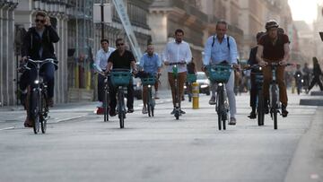 FILE PHOTO: People ride bicycles in the Rue de Rivoli in a warm and sunny day in Paris, France, September 14, 2020. REUTERS/Gonzalo Fuentes/File Photo