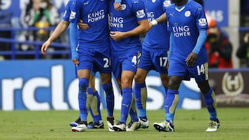 Riyad Mahrez celebrates with team mates after scoring the first goal for Leicester against Swansea.