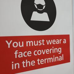 Where has Omicron been confirmed and which countries have implemented travel bans?