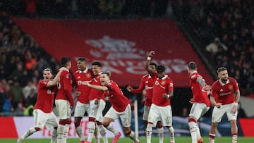 Manchester United players celebrate after they won a penalty shoot out during the English FA Cup semi-final football match between Manchester United and Brighton and Hove Albion at Wembley Stadium in north west London on April 23, 2023. (Photo by Adrian DENNIS / AFP) / NOT FOR MARKETING OR ADVERTISING USE / RESTRICTED TO EDITORIAL USE