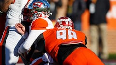 American squad quarterback Bailey Zappe of Western Kentucky (17) is sacked by National Squad defensive lineman Perrion Winfrey of Oklahoma (98).