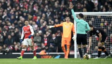 Britain Soccer Football - Arsenal v Hull City - Premier League - Emirates Stadium - 11/2/17 Arsenal's Alexis Sanchez is shown a yellow card by referee Mark Clattenburg for simulation Reuters / Dylan Martinez Livepic EDITORIAL USE ONLY. No use with unauthorized audio, video, data, fixture lists, club/league logos or "live" services. Online in-match use limited to 45 images, no video emulation. No use in betting, games or single club/league/player publications.  Please contact your account representative for further details.