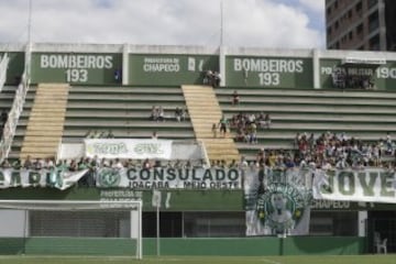 Grieving fans of the Brazilian soccer team Chapecoense gather at the Arena Conda stadium, in Chapeco, Brazil, Tuesday, Nov. 29, 2016. A chartered plane that was carrying the Brazilian soccer team to the biggest match of its history crashed into a Colombian hillside and broke into pieces, Colombian officials said Tuesday. (AP Photo/Andre Penner)