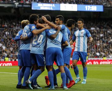 The Málaga players celebrate.